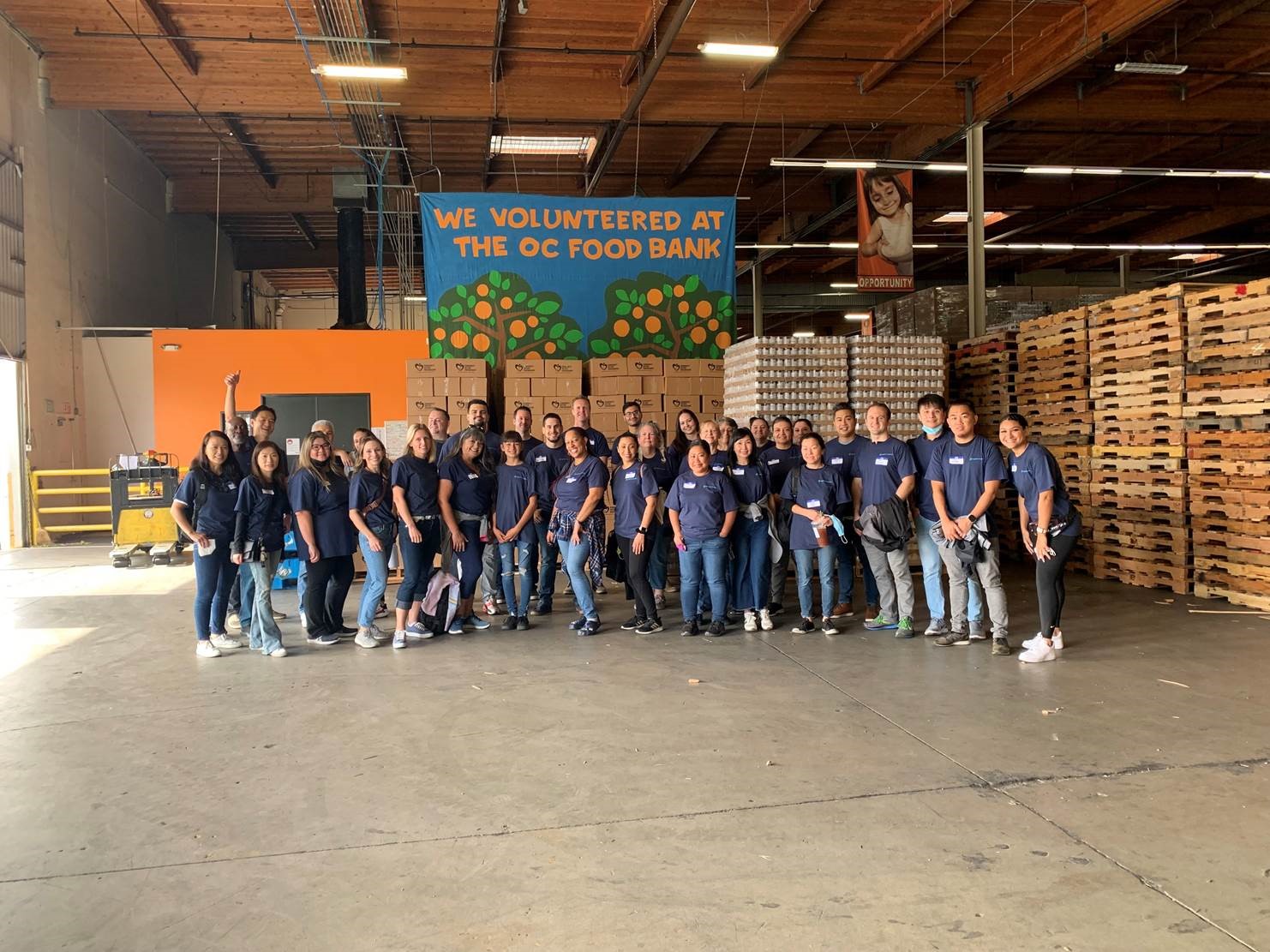 Group shot of agilon employees at a food bank.
