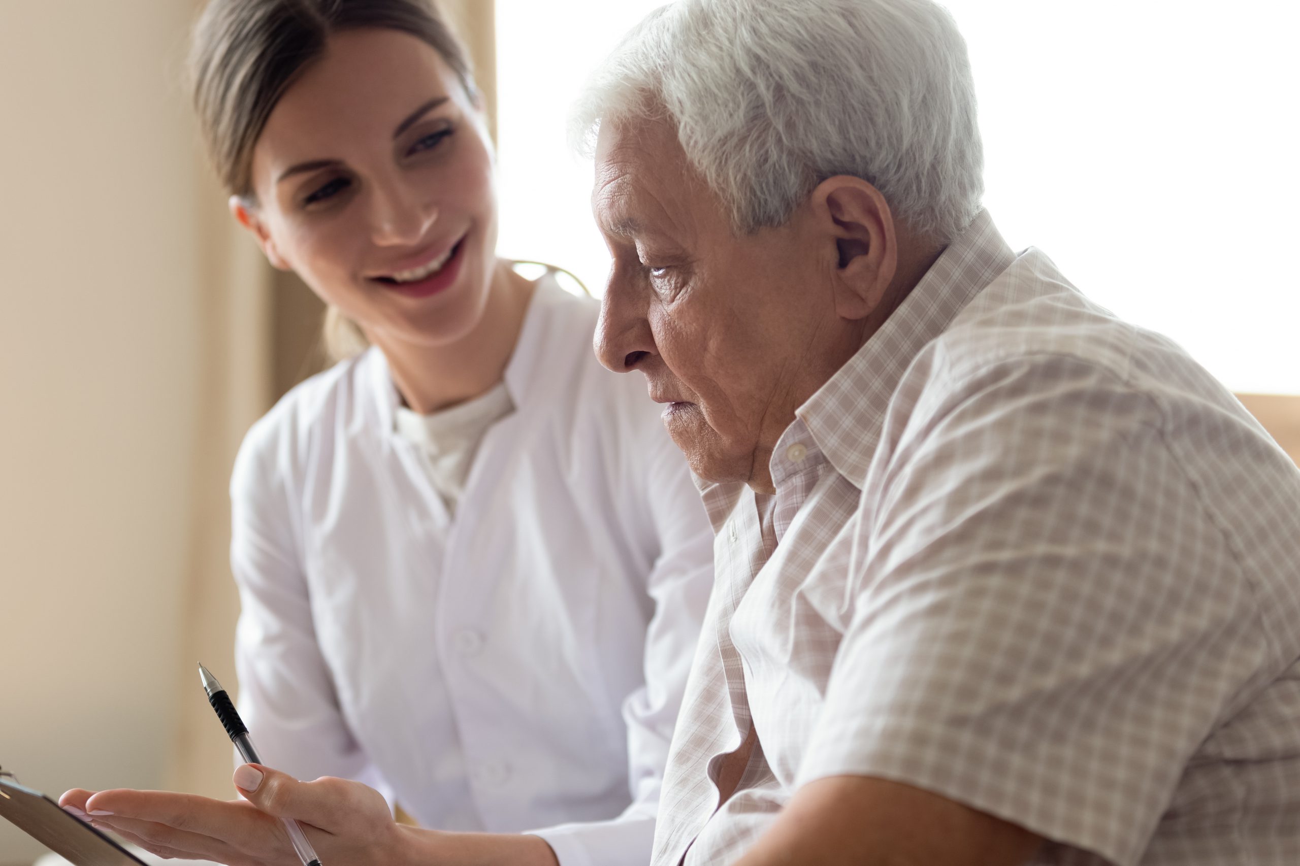 Generic stock photo of nurse or doctor with an older patient.