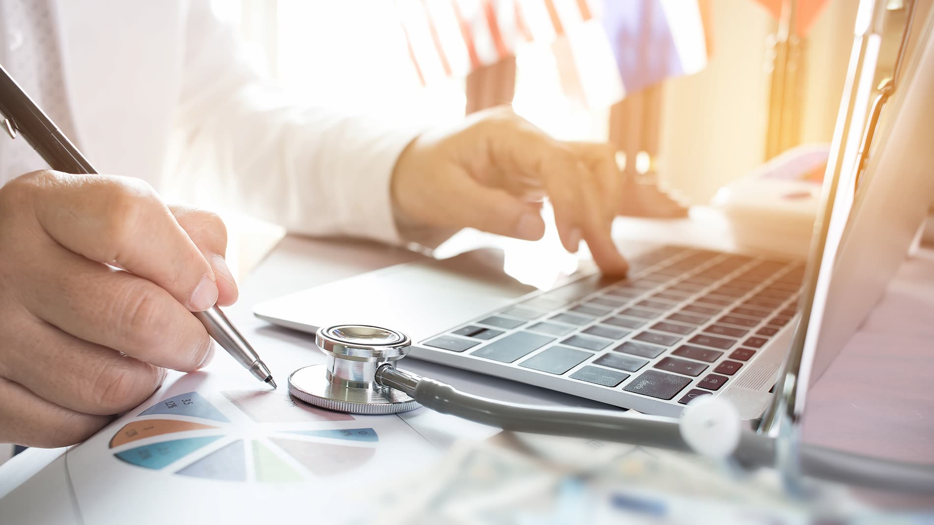 Generic stock photo of doctor at a computer.