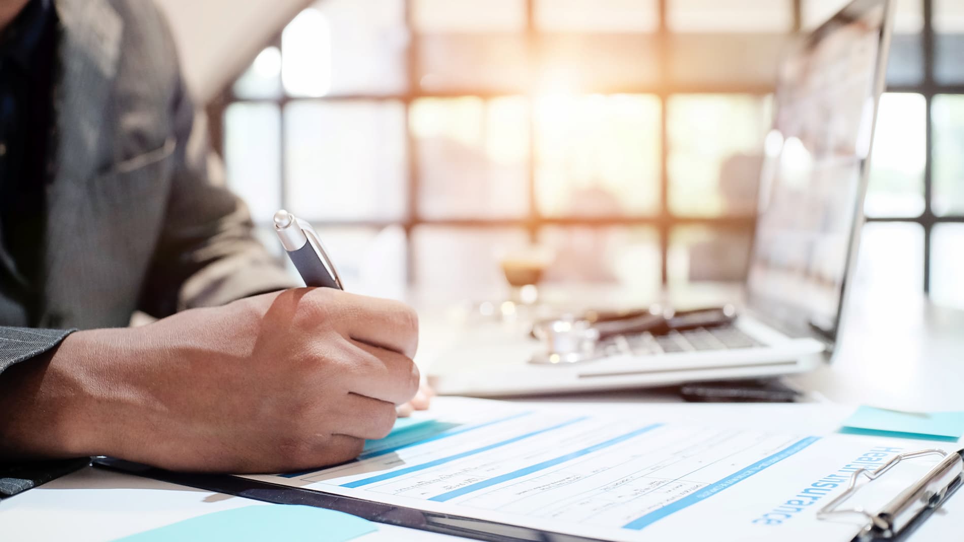 Generic stock photo of a doctor writing something.