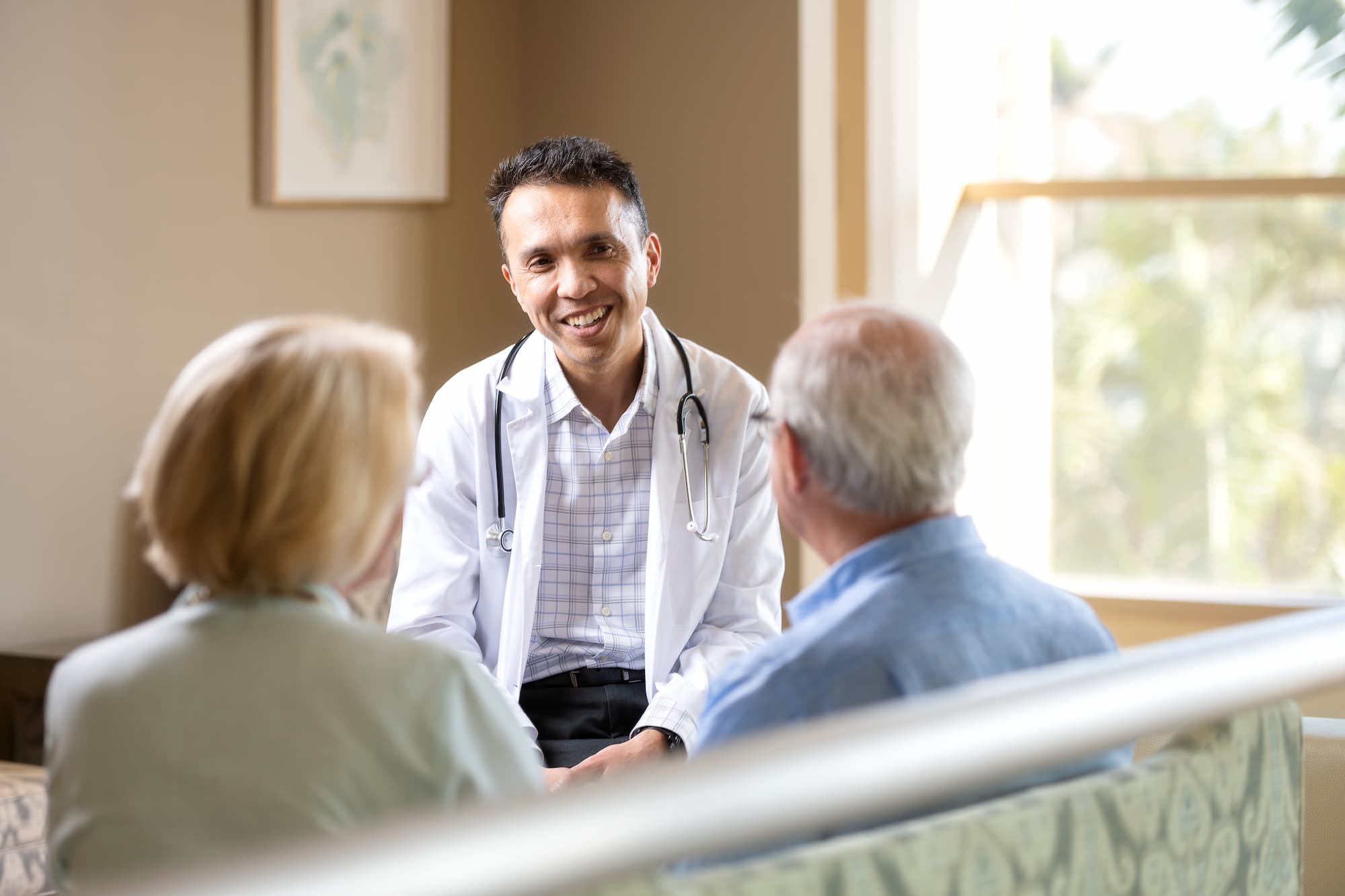 Photo of doctor with two patients.