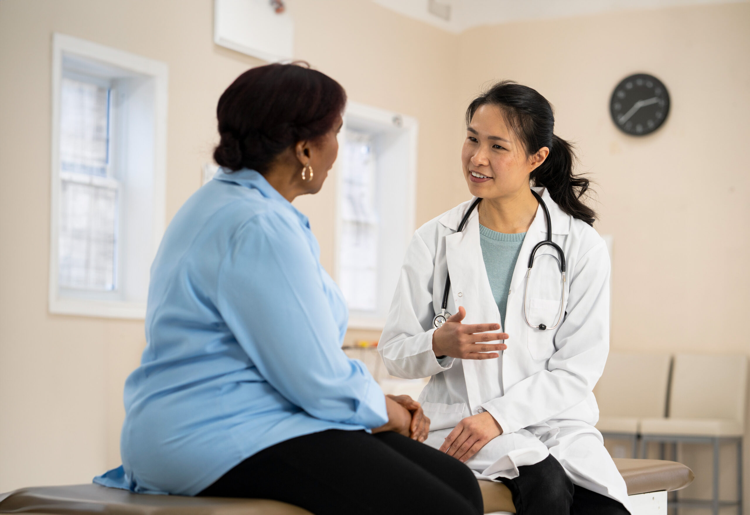 Generic stock photo of a doctor with a female patient.